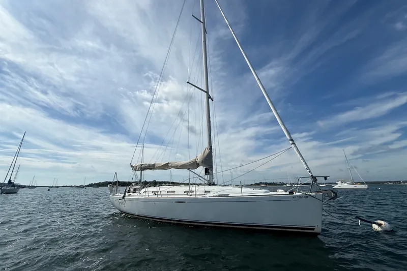Slide: The Image of Sailing yacht Beneteau First 44.7 (2006) on calm waters under a blue sky. - 3