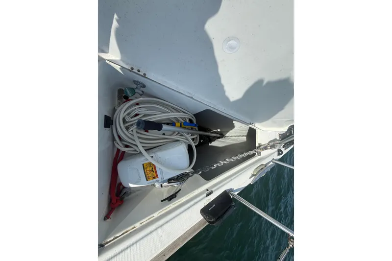 Slide: The Image of Storage compartment on a 2006 Beneteau First 44.7 sailboat with coiled rope and equipment. - 17