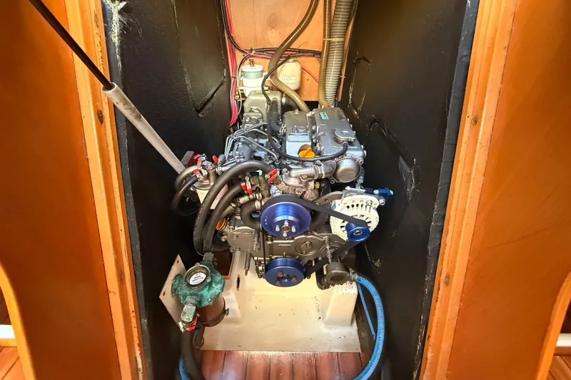 Slide: The Image of Engine compartment of a 2006 Beneteau First 44.7 sailboat, showcasing mechanical components. - 40