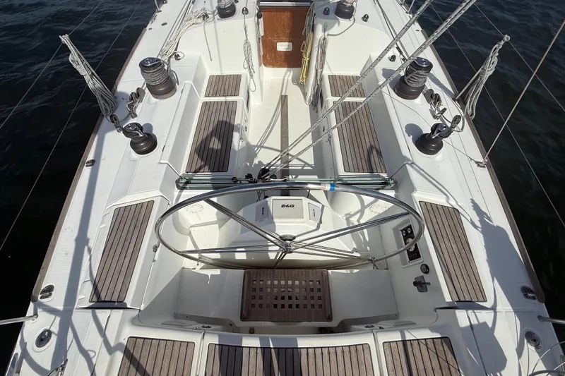 Slide: The Image of Cockpit of 2006 Beneteau First 44.7 sailboat with dual steering wheels and teak seating. - 6