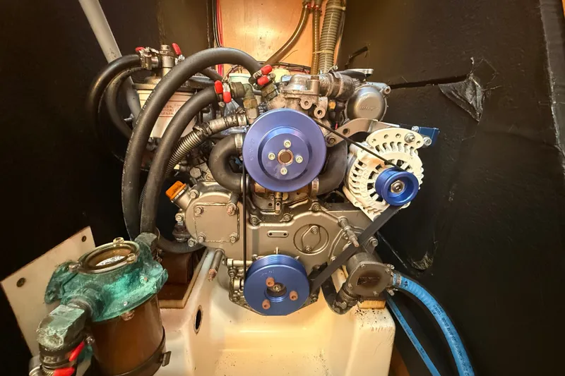 Slide: The Image of Engine compartment of a 2006 Beneteau First 44.7 sailboat, showcasing mechanical components. - 39