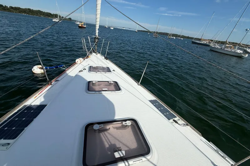 Slide: The Image of Sailing yacht Beneteau First 44.7 (2006) on calm waters, showcasing deck and hatches. - 15