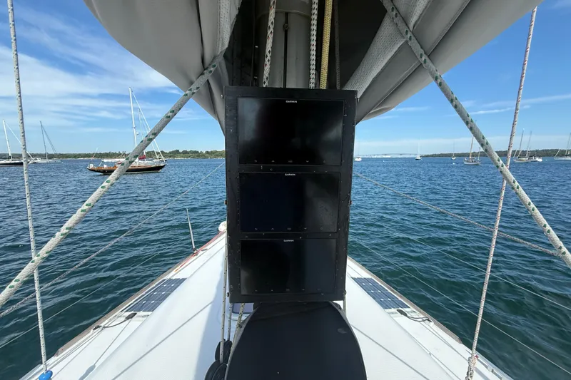 Slide: The Image of Sailing on a 2006 Beneteau First 44.7 yacht, featuring a sleek deck and navigation equipment. - 14