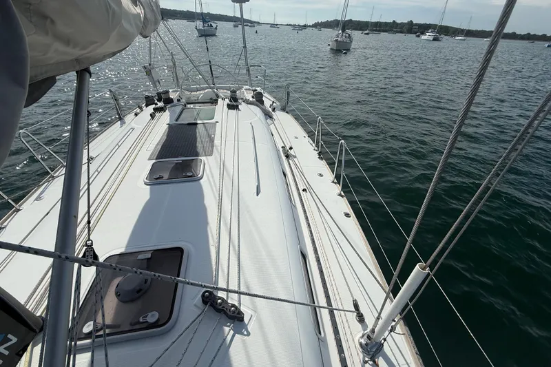 Slide: The Image of 2006 Beneteau First 44.7 sailboat deck view on calm waters. - 9