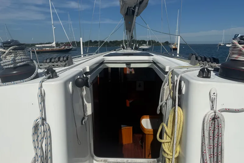 Slide: The Image of Cockpit view of a 2006 Beneteau First 44.7 sailboat with ropes and open cabin. - 20