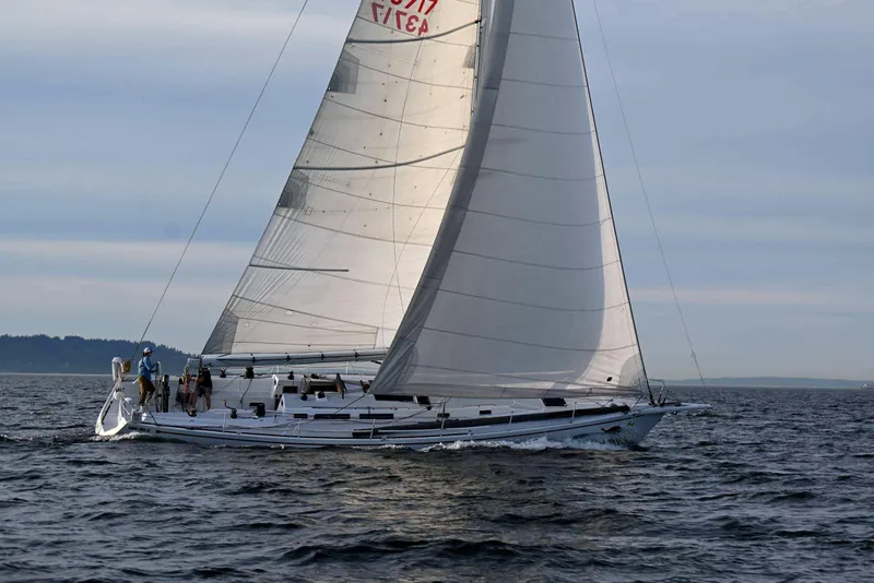 Slide: The Image of Sailing yacht Santa Cruz 52 from 1992 gliding on open water under clear skies. - 8