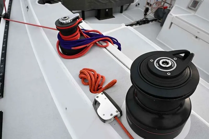 Slide: The Image of Deck of 1992 Santa Cruz 52 sailboat with winches and ropes. - 50