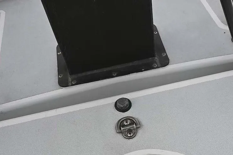 Slide: The Image of Close-up of a 1992 Santa Cruz 52 boat deck with hardware details. - 47