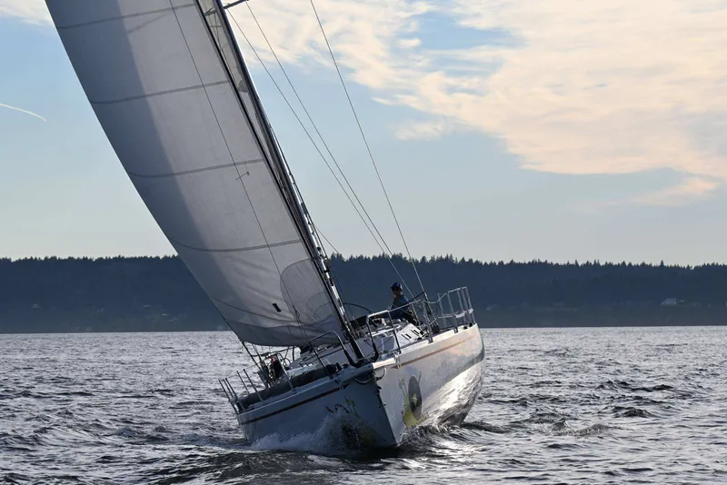 Slide: The Image of Sailing yacht Santa Cruz 52 from 1992 gliding on open water under a clear sky. - 9