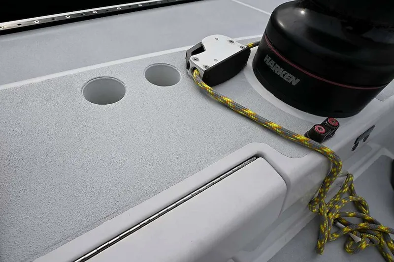 Slide: The Image of Deck of 1992 Santa Cruz 52 sailboat with Harken winch and yellow rope. - 34