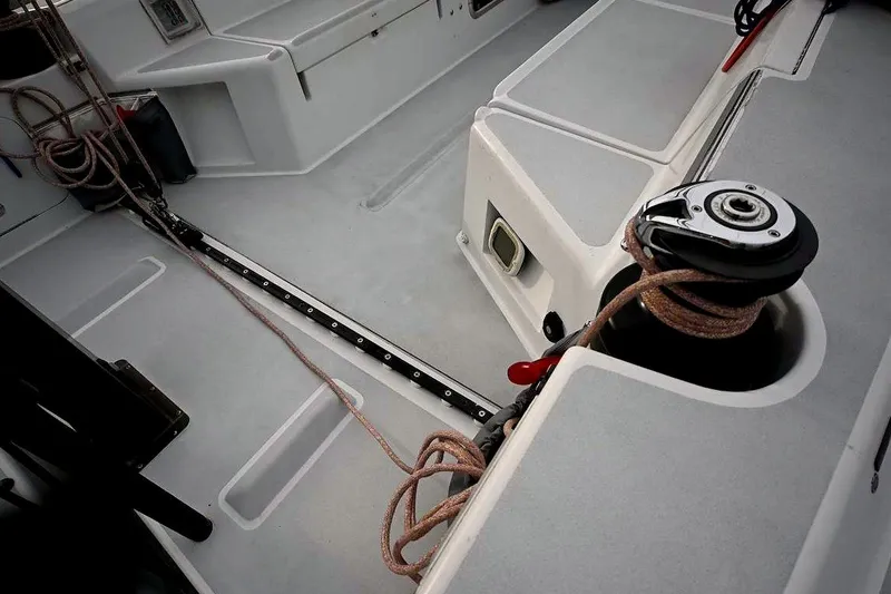 Slide: The Image of Interior view of a 1992 Santa Cruz 52 sailboat deck with winch and ropes. - 45