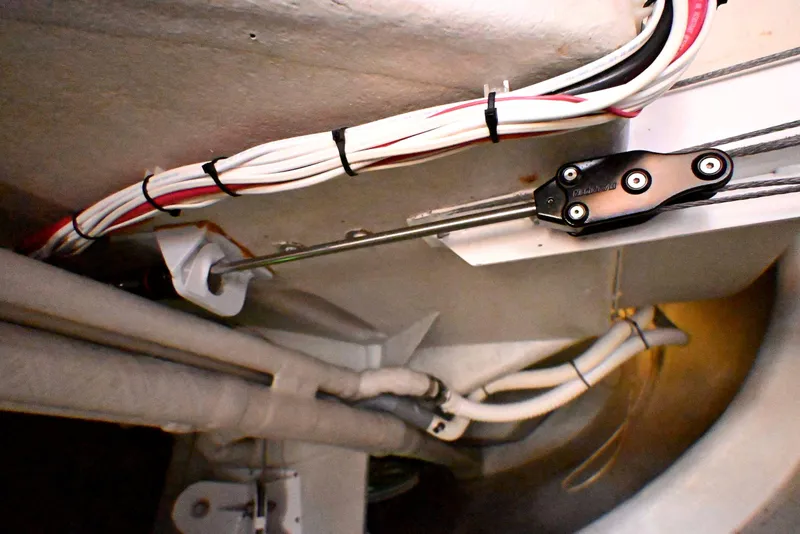 Slide: The Image of Interior view of a 1992 Santa Cruz 52 sailboat showing wiring and mechanical components. - 55