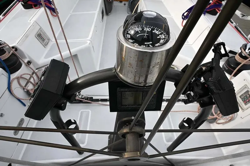 Slide: The Image of Cockpit view of a 1992 Santa Cruz 52 sailboat with compass and navigation equipment. - 37