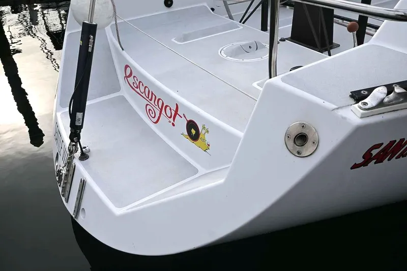 Slide: The Image of Sailboat stern with "Escargot" decal, Santa Cruz 52, 1992 model, docked in Seattle. - 39