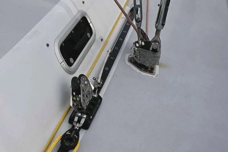 Slide: The Image of Close-up of 1992 Santa Cruz 52 sailboat deck hardware and rigging components. - 53
