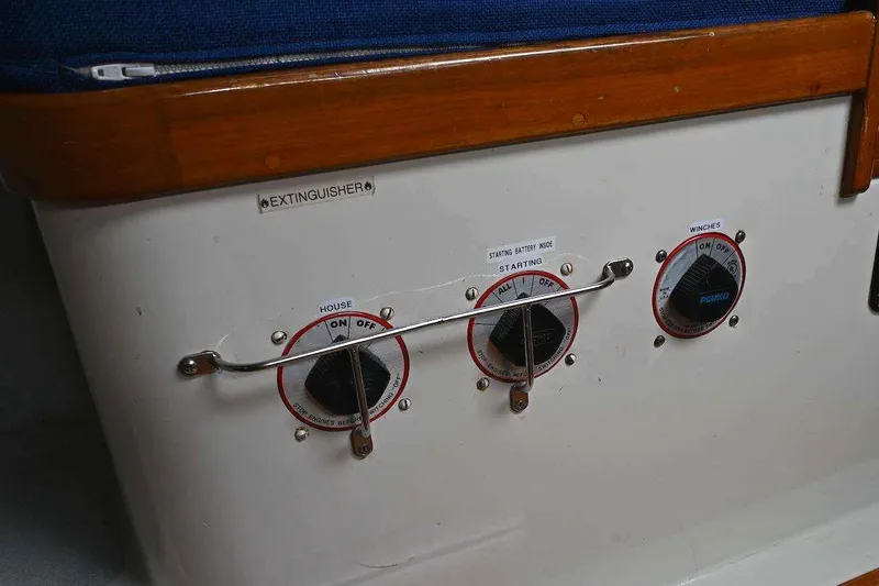 Slide: The Image of Control panel on a 1992 Santa Cruz 52 yacht with labeled switches. - 29