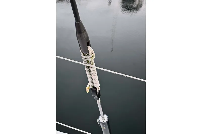 Slide: The Image of Close-up of a Santa Cruz 52 sailboat rigging detail, 1992 model, over calm water. - 40