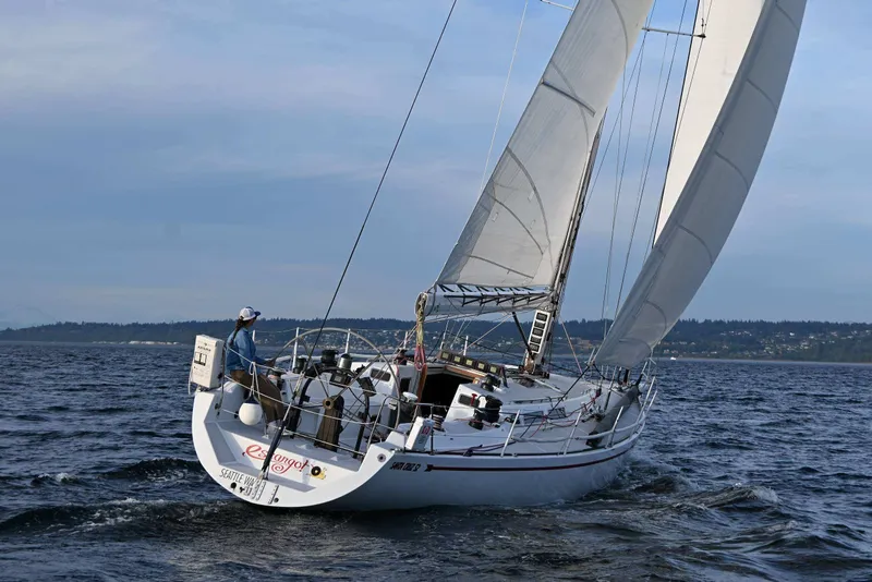 Slide: The Image of Sailing yacht Santa Cruz 52 from 1992 on open water, with sails fully extended. - 3