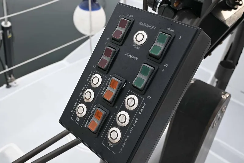 Slide: The Image of Control panel on a 1992 Santa Cruz 52 sailboat, featuring various buttons and switches. - 36