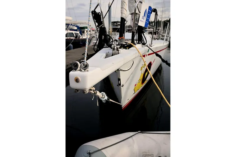Slide: The Image of Sailboat docked at marina, Santa Cruz 52, 1992 model, with nautical equipment visible. - 42