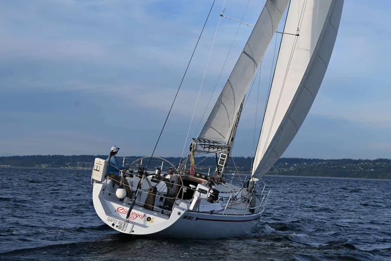 Slide: The Image of Sailing yacht Santa Cruz 52 from 1992 on open water, with full sails. - 4
