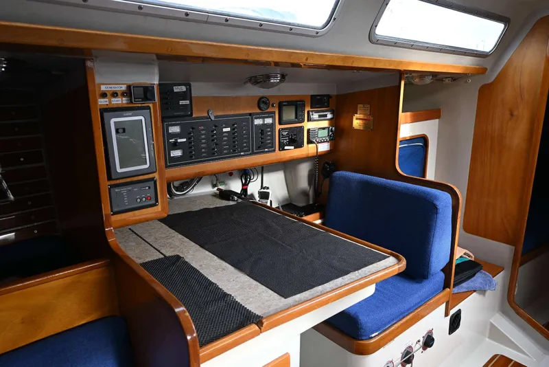 Slide: The Image of Interior of a 1992 Santa Cruz 52 yacht with navigation equipment and seating area. - 20