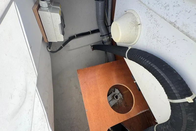 Slide: The Image of Interior view of 2018 Jeanneau Sun Odyssey 389 sailboat, showing electrical and plumbing components. - 63