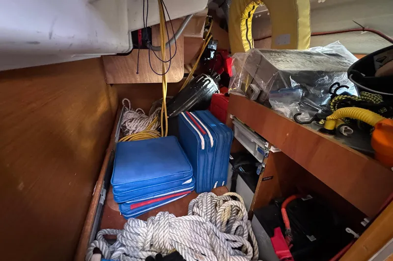 Slide: The Image of Storage area in a 2018 Jeanneau Sun Odyssey 389 sailboat with ropes and equipment. - 59