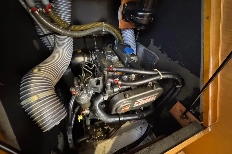 Slide: The Image of Engine compartment of 2018 Jeanneau Sun Odyssey 389 sailboat, showing detailed mechanical components. - 53