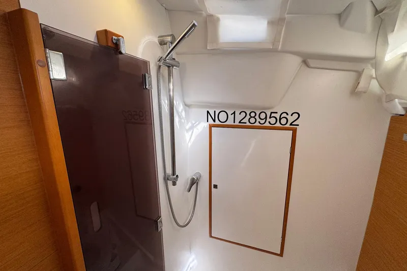 Slide: The Image of Interior of 2018 Jeanneau Sun Odyssey 389 yacht bathroom with shower and storage. - 52