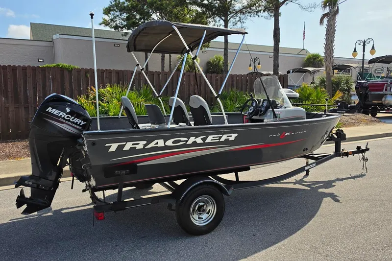 Slide: The Image of 2019 Tracker Pro Guide V-16 SC boat with Mercury engine on trailer. - 15