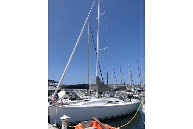 Slide: The Image of 2004 J Boats J/109 sailboat docked in marina under clear blue sky. - 72