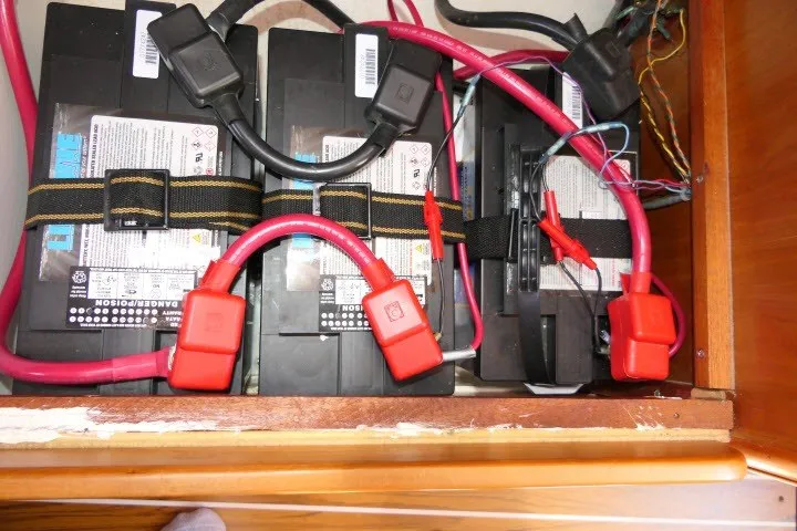 Slide: The Image of Battery compartment of a 2004 J Boats J/109 with red and black cables. - 66