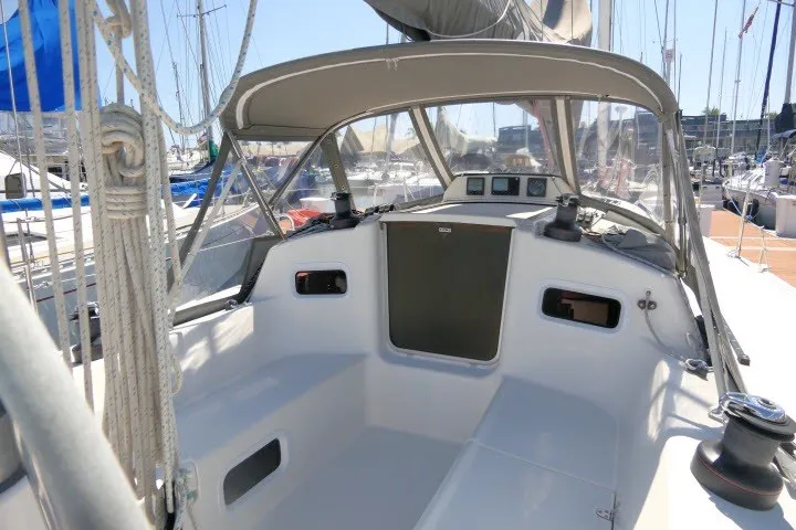 Slide: The Image of 2004 J Boats J/109 sailboat cockpit with canopy, docked at marina. - 37