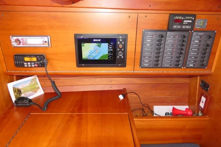 Slide: The Image of Navigation station of a 2004 J Boats J/109, featuring control panels and communication equipment. - 13