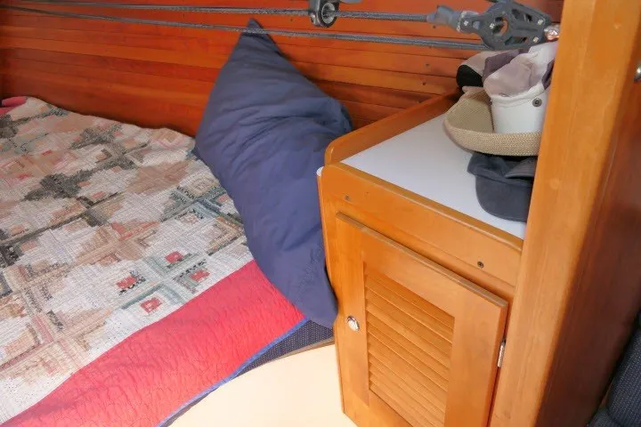Slide: The Image of Cozy cabin interior of 2004 J Boats J/109 with quilted bedding and wooden cabinetry. - 27