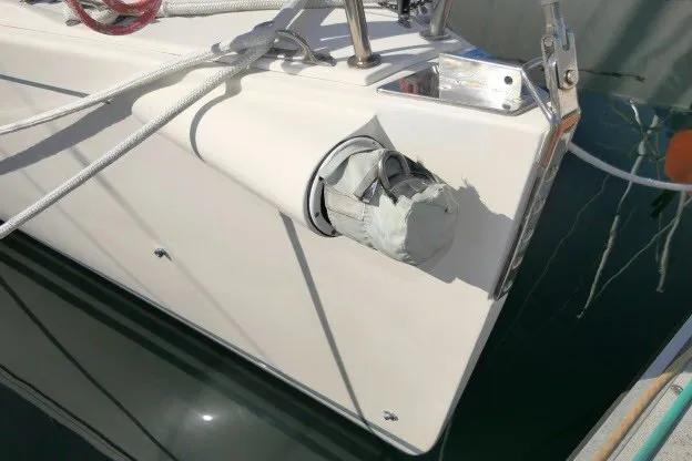 Slide: The Image of 2004 J Boats J/109 sailboat with duct-taped fitting on deck, docked in marina. - 61