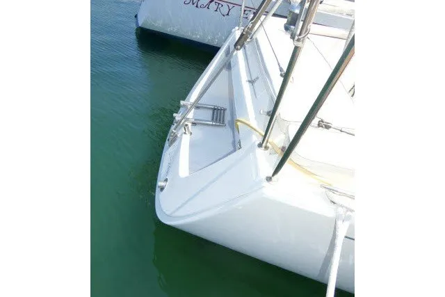 Slide: The Image of 2004 J Boats J/109 sailboat bow in calm water. - 63