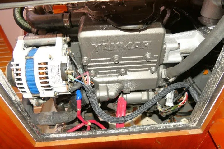 Slide: The Image of Yanmar engine inside a 2004 J Boats J/109 sailboat, showcasing mechanical components. - 65