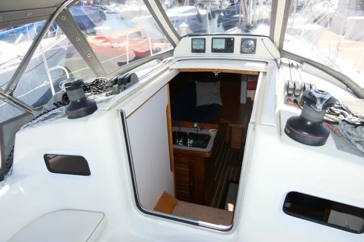 Slide: The Image of 2004 J Boats J/109 yacht cockpit with navigation instruments and cabin entrance. - 41