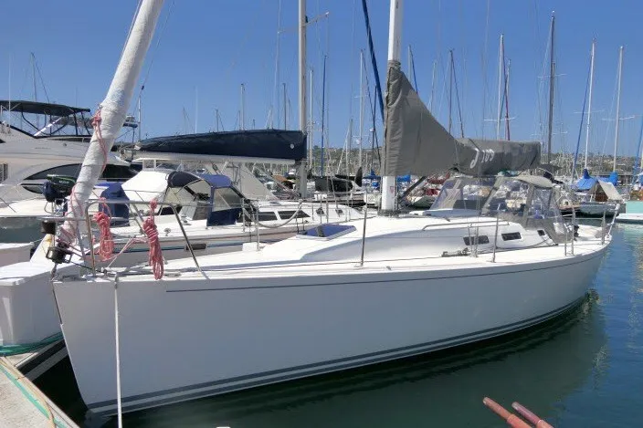 The Image of 2004 J Boats J/109 sailboat docked in a marina under clear blue skies. - 1