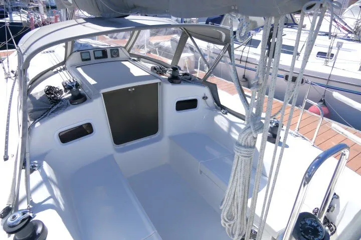 Slide: The Image of 2004 J Boats J/109 sailboat cockpit with ropes and winches, docked at marina. - 39