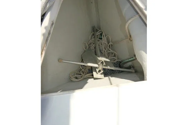 Slide: The Image of Anchor and ropes in the bow compartment of a 2004 J Boats J/109 sailboat. - 58