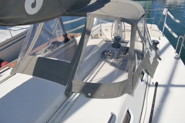 Slide: The Image of 2004 J Boats J/109 sailboat with protective canopy and winches on deck. - 51