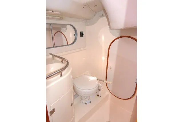 Slide: The Image of 2004 J Boats J/109 yacht bathroom with toilet, sink, and mirror. - 30