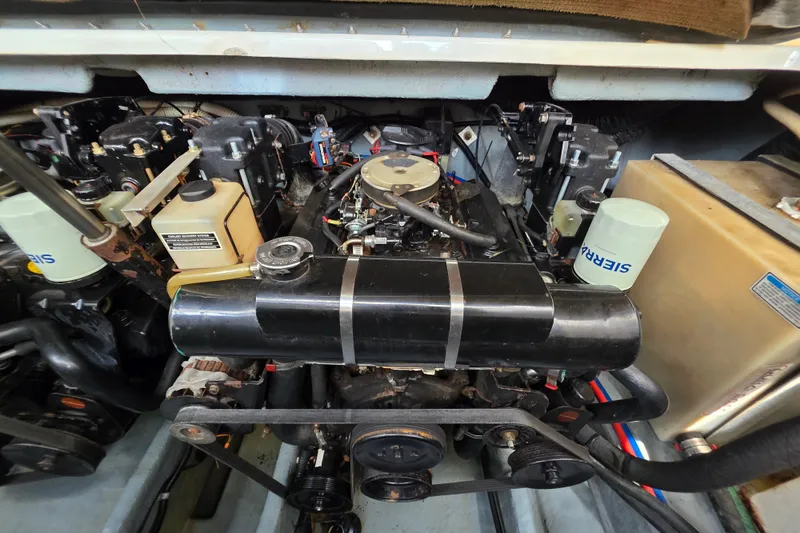 Slide: The Image of Engine compartment of a 1999 Sea Ray Sundancer 330 boat, showcasing mechanical components. - 9