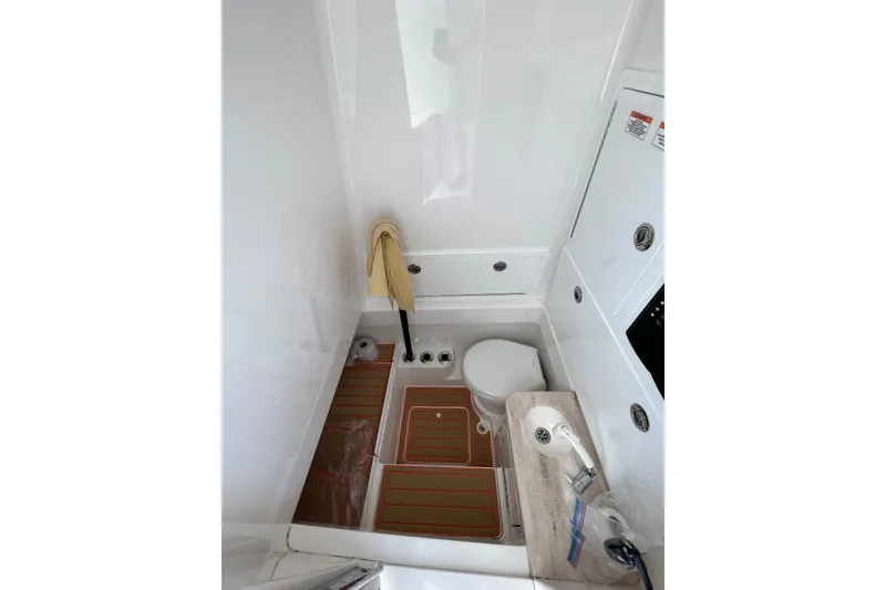 Slide: The Image of Compact bathroom in 2020 Valhalla 33 boat with toilet and sink. - 8
