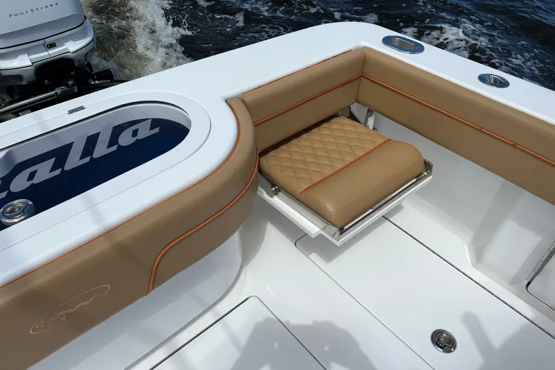 Slide: The Image of 2020 Valhalla 33 boat interior with tan seating and livewell. - 3