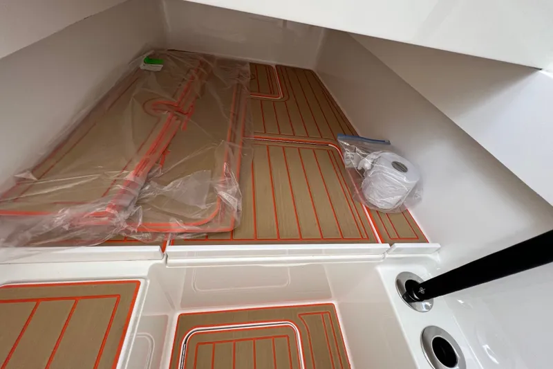 Slide: The Image of Interior of 2020 Valhalla 33 boat with neatly arranged flooring and accessories. - 9