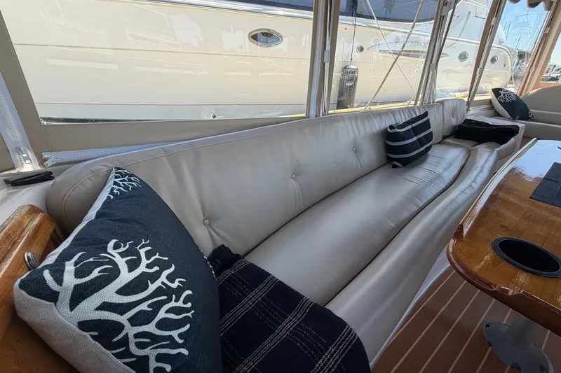 Slide: The Image of Luxurious interior of 2005 Duffy Classic 21 boat with plush seating and decorative pillows. - 14
